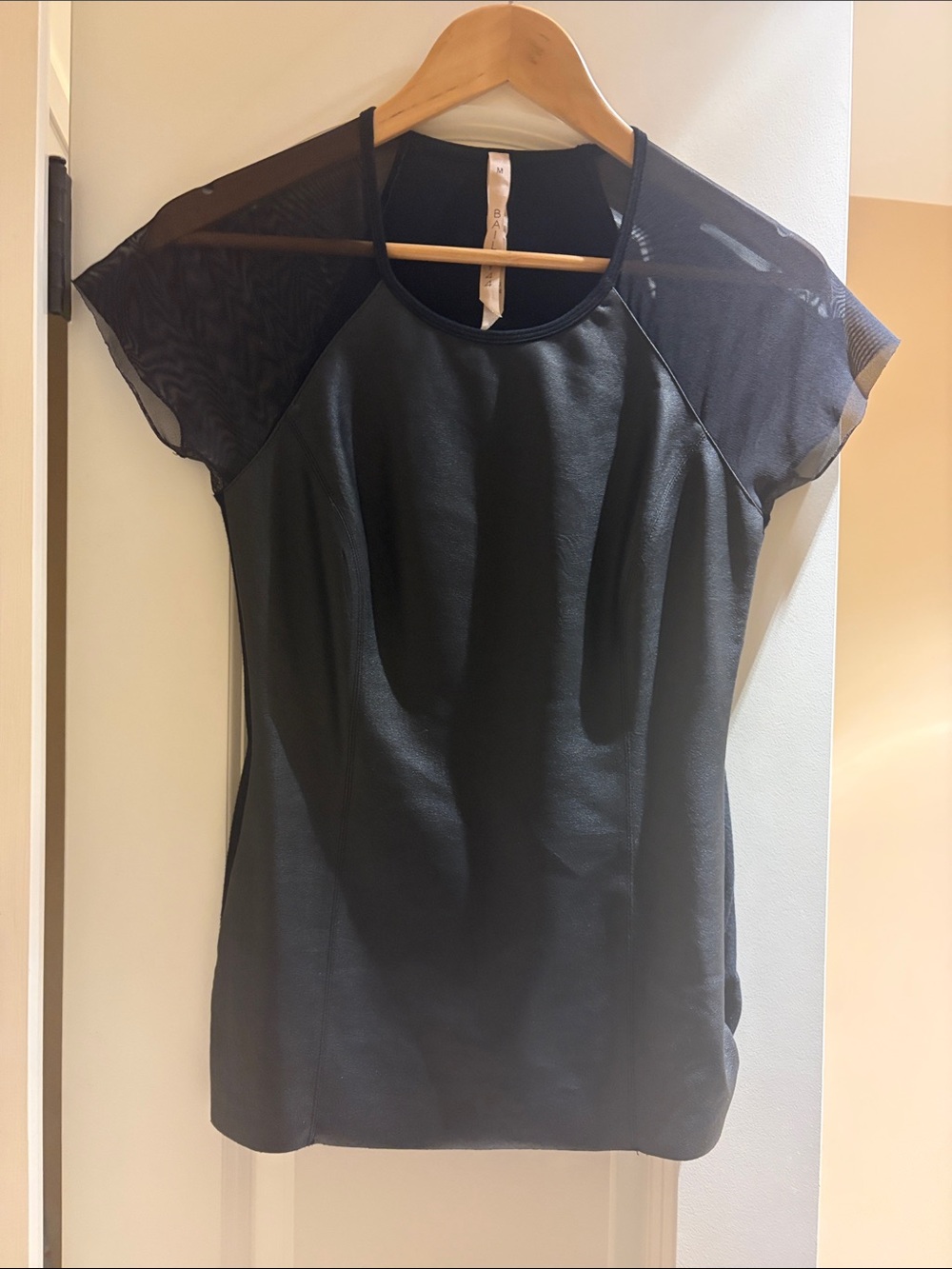 Bailey. Faux leather front cloth back Sheer Sleeve poly and spandex